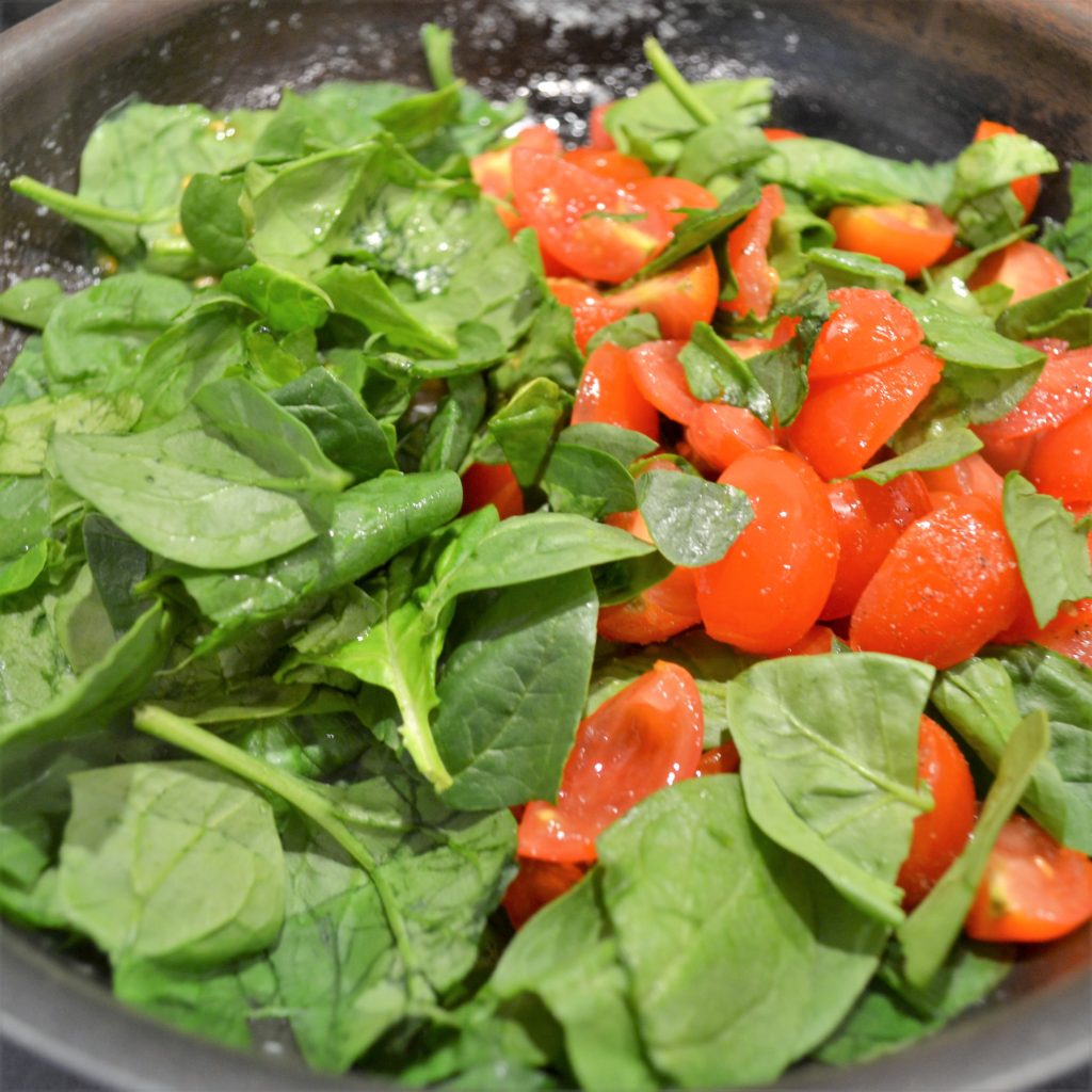 Add spinach and tomato