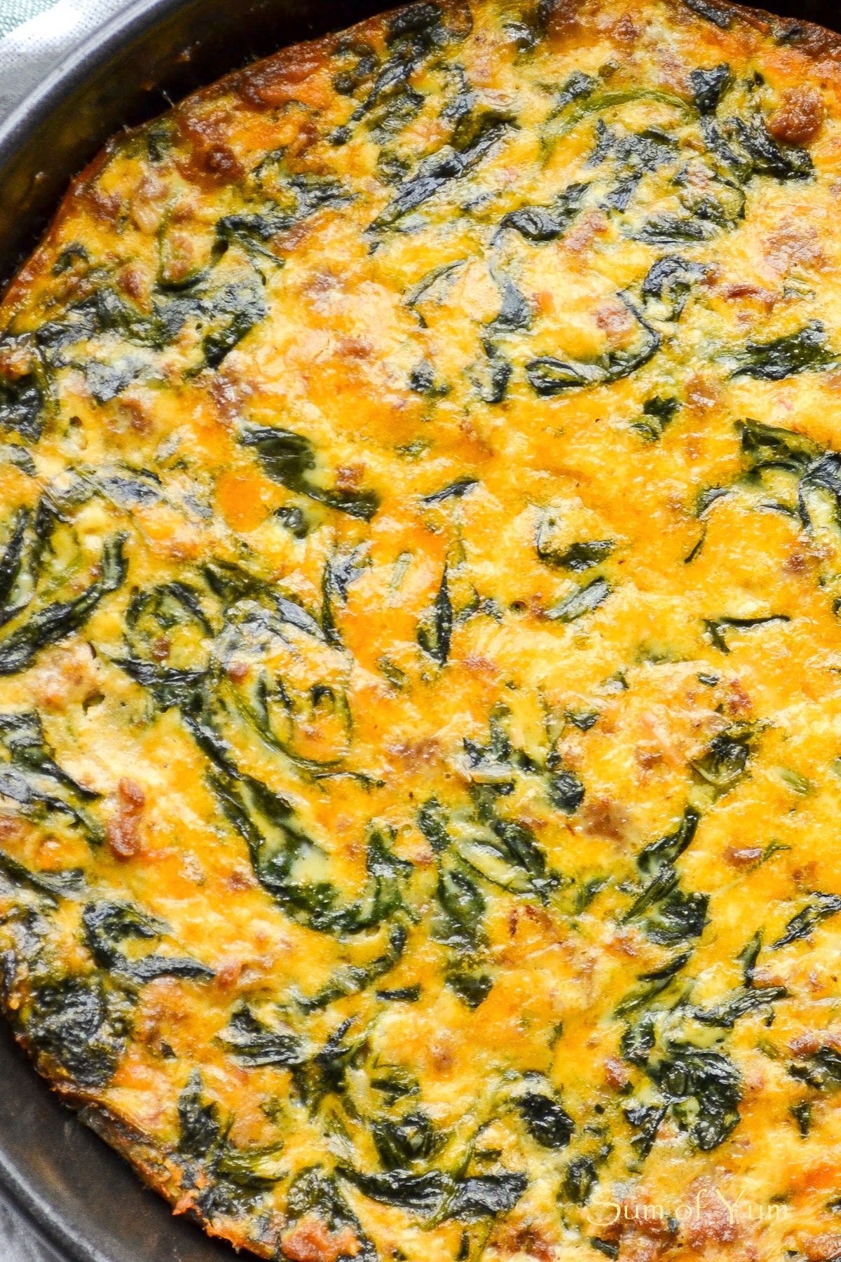 This Crustless Quiche recipe with spinach, goat cheese, and turkey sausage is delicious! Perfect for a low-carb breakfast, lunch, or dinner. SumofYum.com Crustless Quiche with Spinach Goat Cheese