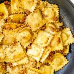 Sage Butter Ravioli with Walnuts in pan