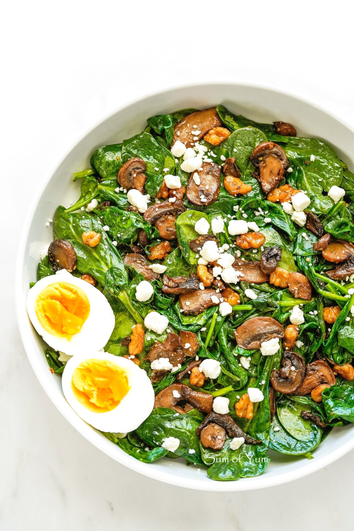 Wilted Spinach Salad with mushrooms, goat cheese, walnuts, and eggs