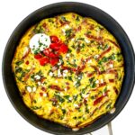 Greek Frittata with spinach, feta cheese, tomatoes, garlic, herbs, and Greek yogurt.