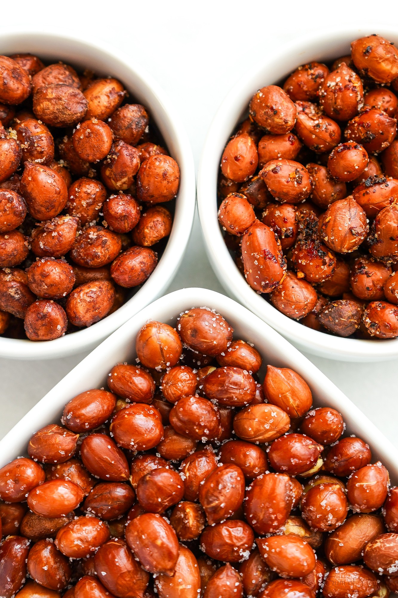 This spicy peanuts recipe for roasted seasoned peanuts includes spicy Mexican peanuts, Tajin chili lime peanuts, and Cajun peanuts. Sum of Yum Seasoned Peanuts