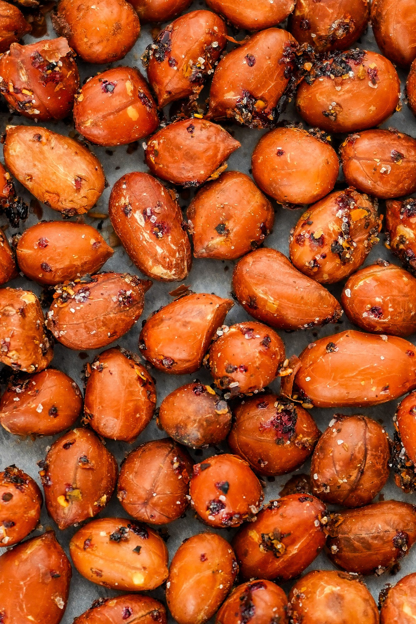 This spicy peanuts recipe for roasted seasoned peanuts includes spicy Mexican peanuts, Tajin chili lime peanuts, and Cajun peanuts. | SumofYum.com Roasted Seasoned Peanuts