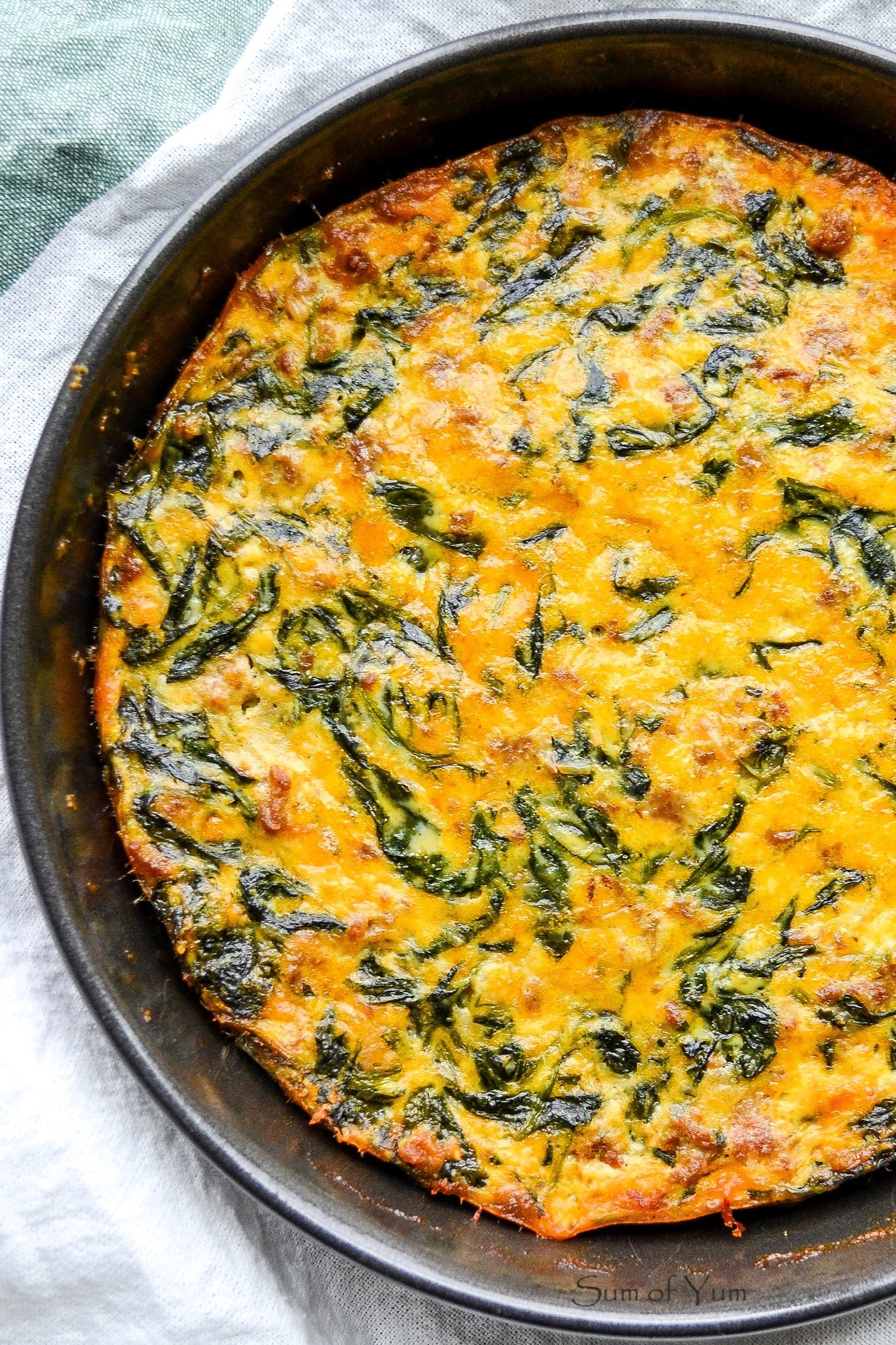 This crustless quiche florentine recipe is a vegetarian French quiche with spinach, and this low-carb crustless spinach quiche is good anytime! SumofYum.com Crustless French Quiche Florentine with spinach
