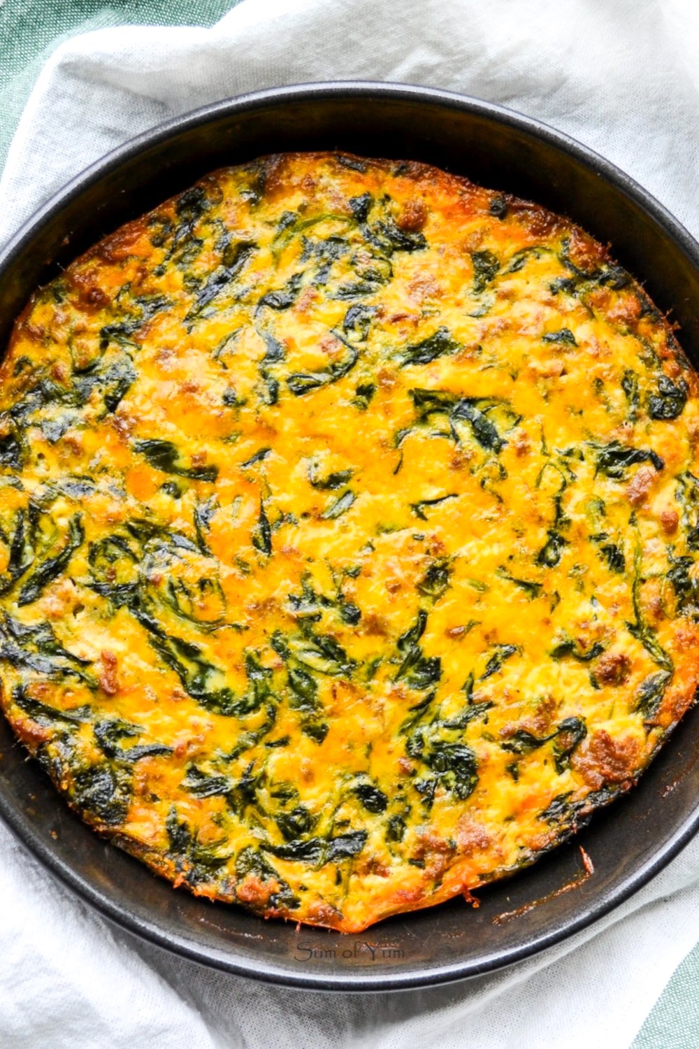 This crustless quiche florentine recipe is a French quiche with spinach, and this low-carb spinach quiche is perfect for brunch or dinner! SumofYum.com Crustless Spinach Quiche