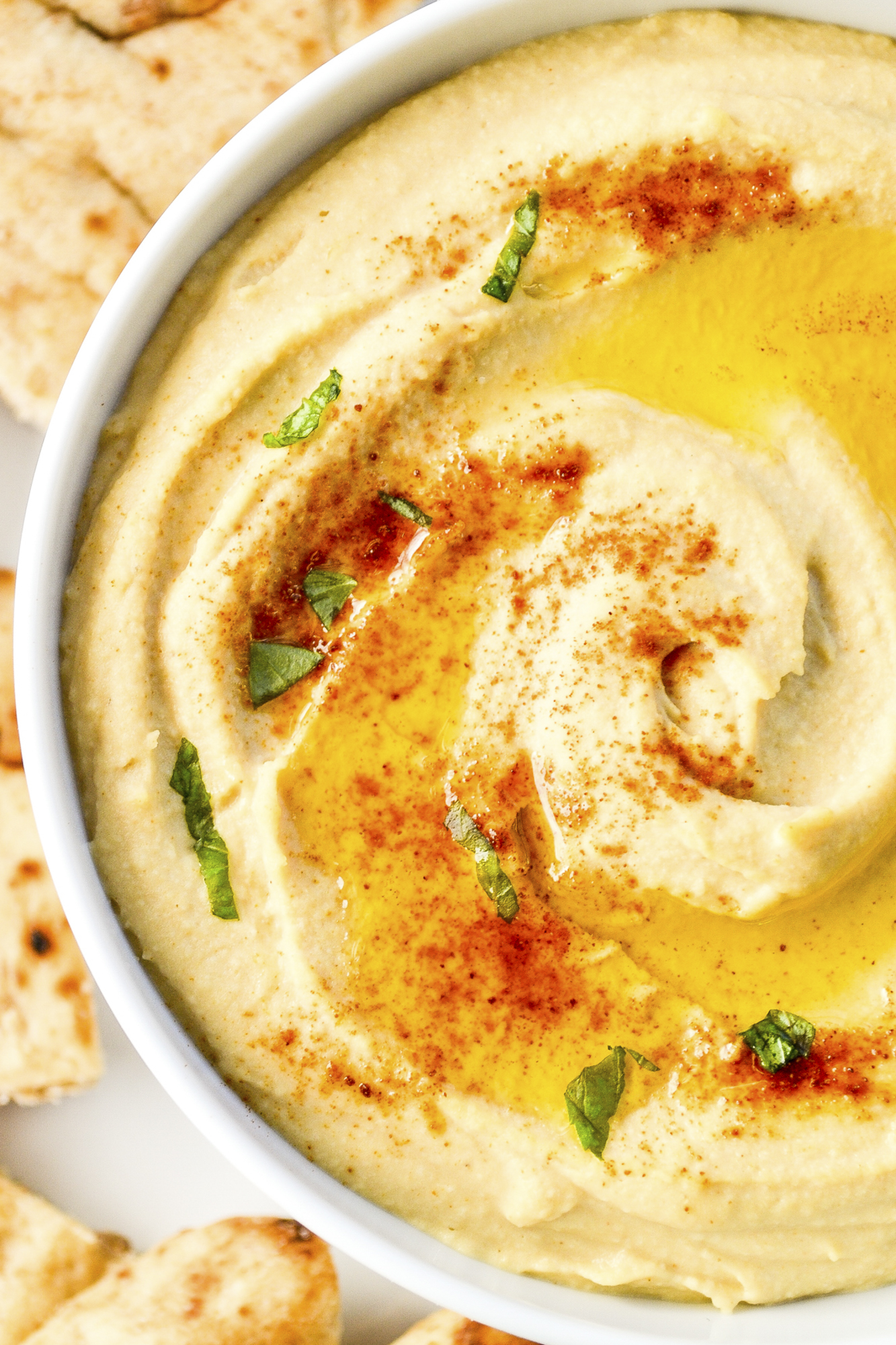 My best easy hummus recipe is smooth, creamy, and delicious! This easy homemade hummus is ready in 5 minutes and better than store-bought! SumofYum.com Organic Hummus