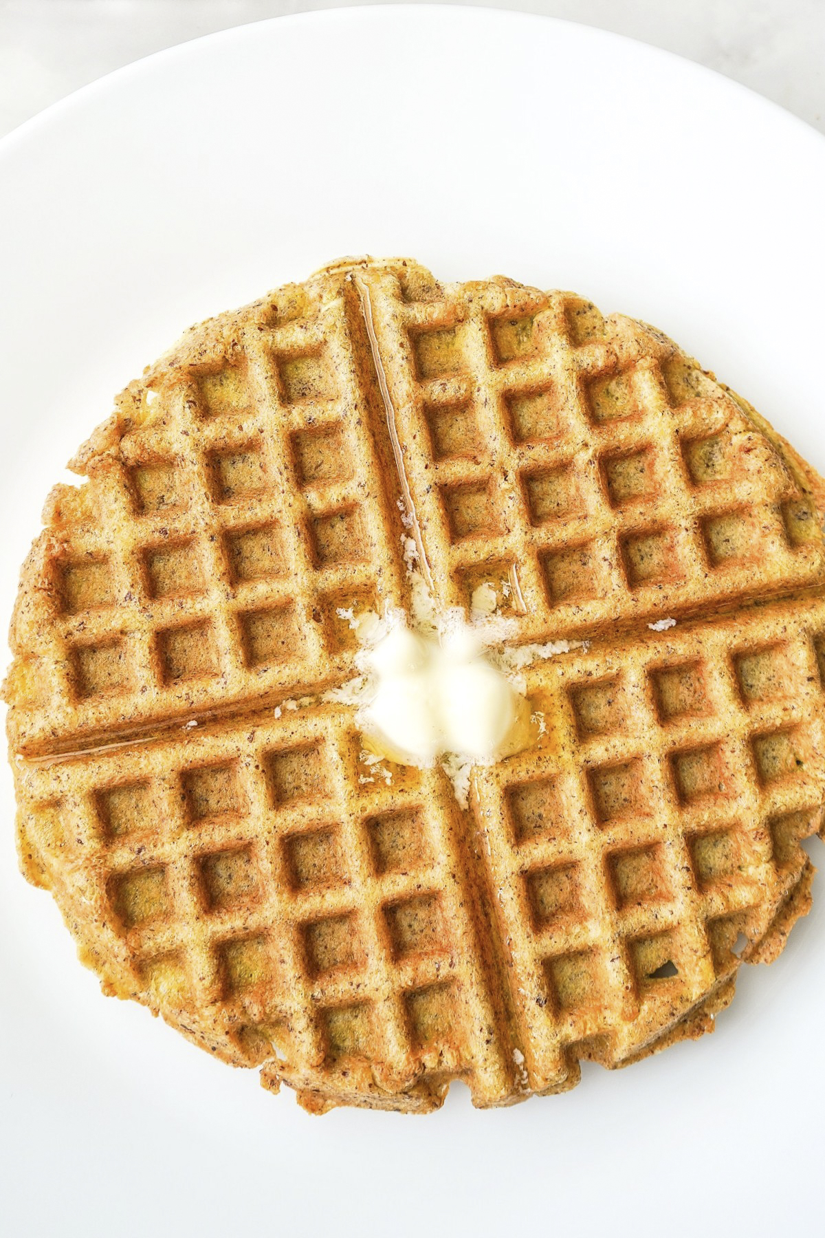 This easy grain-free waffle recipe is gluten-free, sugar-free, and makes delicious keto flourless protein waffles high in fiber and omega-3s. SumofYum.com Flourless Waffle