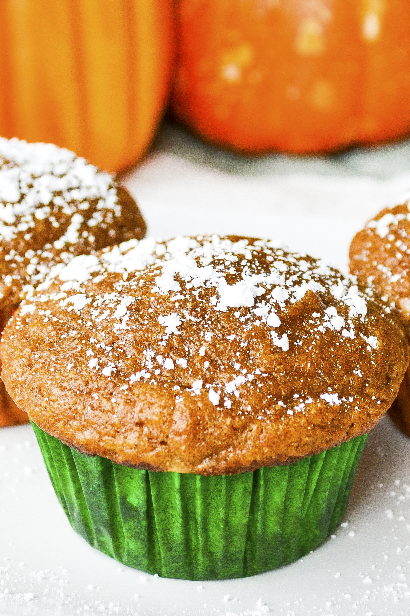 Pumpkin cake muffins made from scratch are moist and delicious. This easy pumpkin muffin recipe includes pumpkin pecan muffins and more! SumofYum.com Pumpkin Cake Muffins